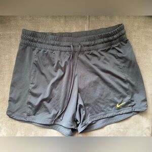 Nike Women's Dark Gray Athletic Shorts with Yellow Logo